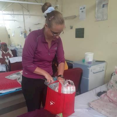 Maryanne handing out parcels