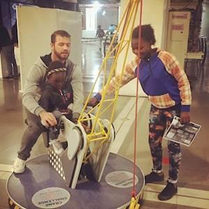 Aldah and Mumu spending a day at SciBono Science Center with their Mentor Clinton